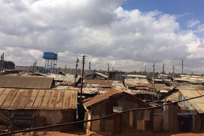 Kevins Kibera Slum Tours - Walking the main street market