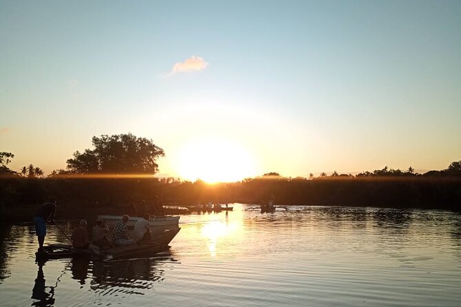 Kongo River Sunset Experience in Canoe - Boarding a traditional canoe at the estuary