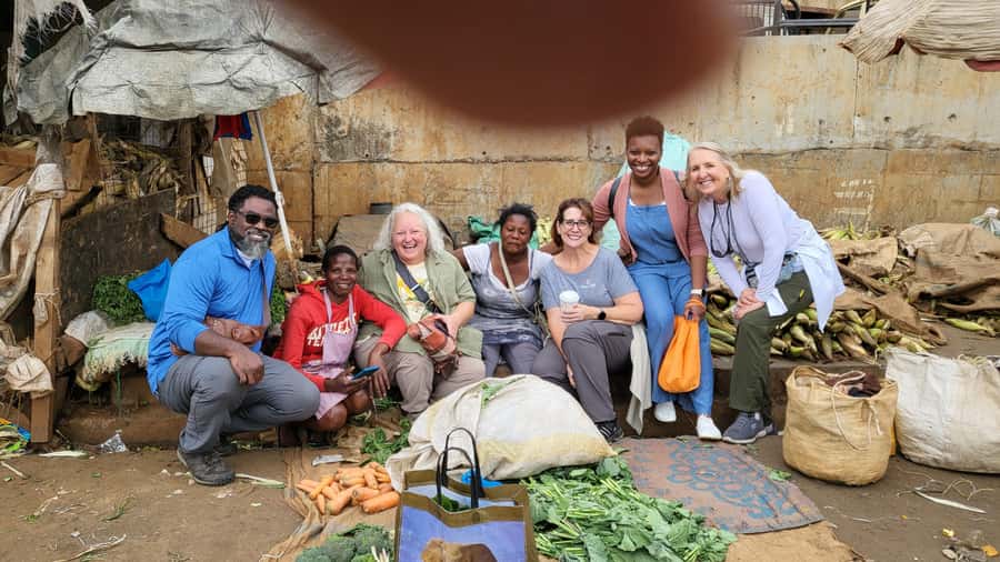 Local Market Tour and Traditional Meal Cooking Class - Shopping for ingredients in a working market